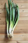 Leeks on a wooden table