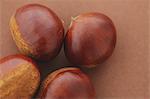 Chestnuts on brown background