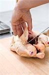 The cutting up of a chicken.
