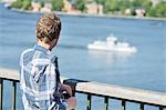 A young man looking at Stockholm, Sweden.