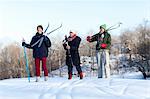 Three people cross country skiing