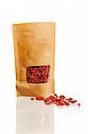 Dried goji berries in bag, studio shot