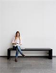 Young student sitting on bench