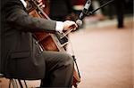 man playing cello on the concert, selective focus