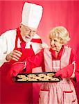 Chef admires the delicious chocolate chip cookies baked by a homemaker.