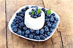 Fresh blueberry cake on rustic wooden table