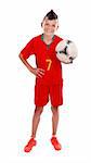 Young boy holding soccer ball, studio shot