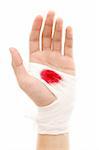Hand of a man with bloody gauze on it