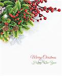 Christmas background with wreath, berries, decorations on white