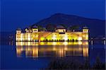 The palace Jal Mahal at night.  Jal Mahal (Water Palace) was built during the 18th century in the middle of Mansarovar Lake.  Jaipur, Rajasthan, India.