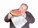 Fat man with a serviette around his neck as a bib tucking into a large slice of fresh juicy watermelon with a look of anticipation and glee isolated on white