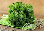 Fresh green, organic parsley on wooden table