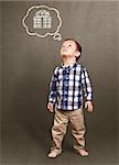 Baby looking up, cute little boy in studio