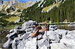 leather hiking shoeson stone  in Alps