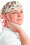 Portrait of a beautiful, courageous cancer patient in a head scarf.  White background.