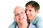 Female cancer survivor posing with ther loving husband.