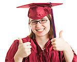 Young female college or high school graduate giving the thumbs up sign.  Isolated on white.