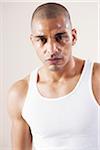 Man Wearing Work Out Clothes and Sweating in Studio with White Background