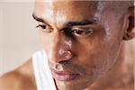 Close-Up Man's Sweating Face in Studio with White Background