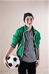 Portrait of Boy with Soccer Ball in Studio