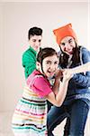 Children Pulling on Rope in Studio