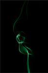 Green smoke on black background