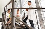 Doctors talking on steps in hospital