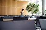 Man standing in empty cafeteria