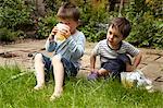 Boys relaxing in garden