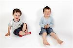 Boys smiling together on floor