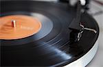 Close up of needle playing record