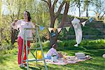 Woman hanging bunting outdoors