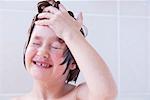 Girl washing her face in bath