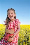 Girl holding sack of apples outdoors