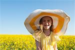 Girl wearing sun hat outdoors