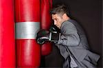 Boxer training with punching bag