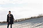 Smiling woman standing on beach