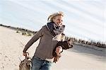 Smiling woman walking on beach