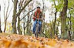 Man riding bicycle in park