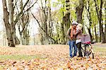 Couple kissing by bicycle in forest