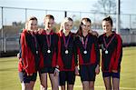 Sports team wearing medals