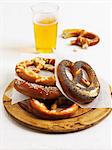 Various lye bread pretzels and a glass of beer