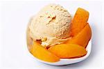 Apricot ice cream garnished with apricot wedges