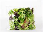 Mixed green salad in a plastic bag