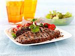 Grilled steak with tomato salad