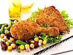 Breaded chicken legs with sweetcorn and beans