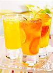 Three tangerine and grapefruit drinks