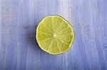 Half a lime on a blue surface