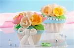 Cupcakes decorated with marzipan flowers