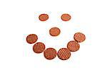 Biscuits arranged in shape of smiley face over white background